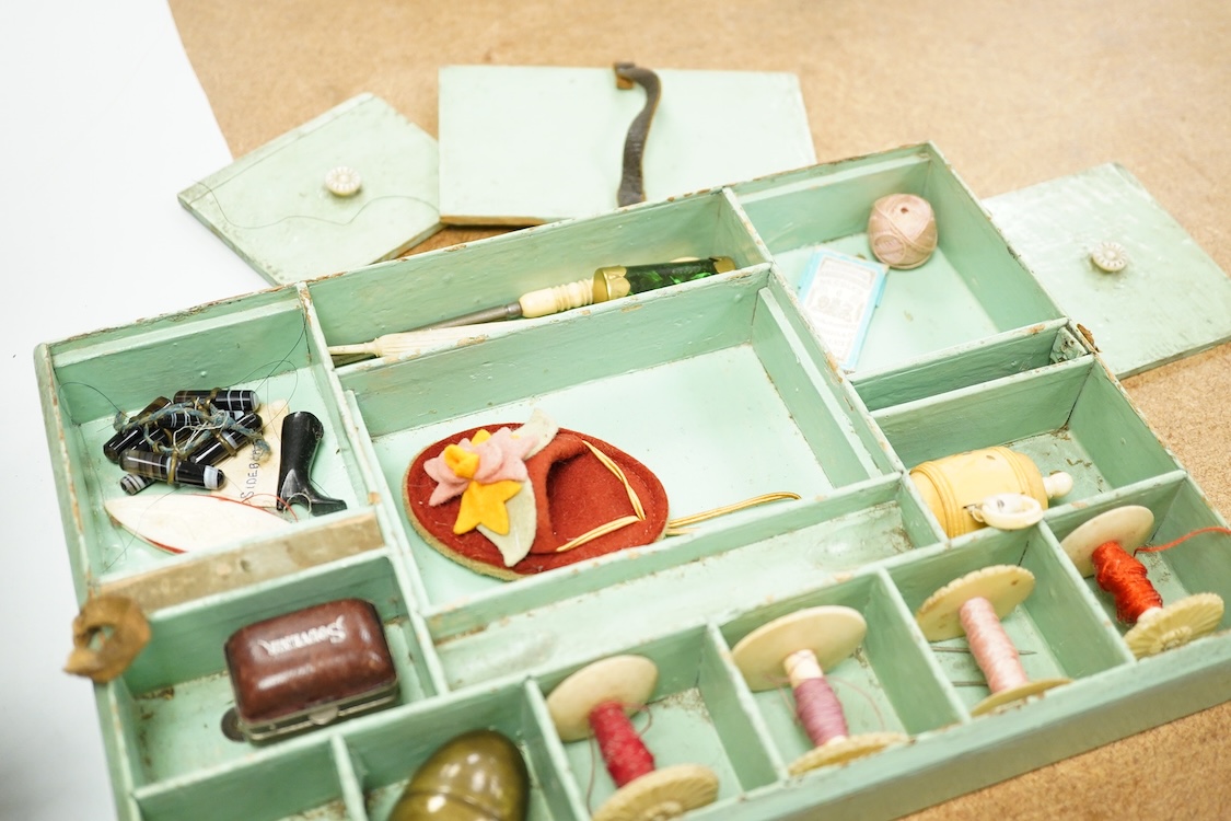 A Victorian mother of pearl inlaid rosewood sewing box and contents including a silver thimble and carved bone thread reels, 33cm wide